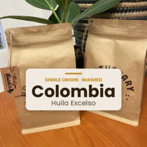 Bag of Apothecary Colombia Huila Excelso coffee beans, labelled